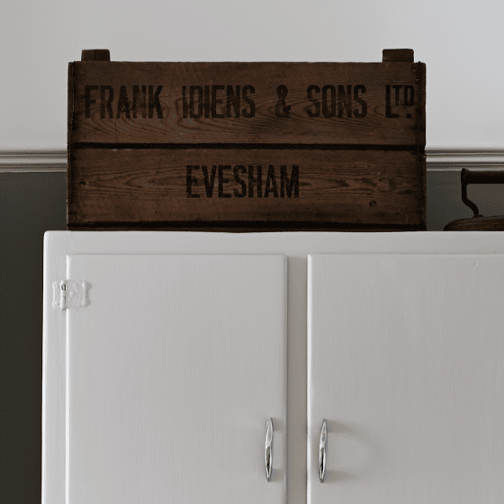 Ellie keeps a crate on top of her wardrobe for extra storage space